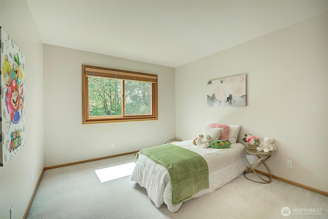 carpeted bedroom featuring baseboards