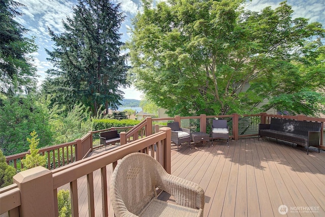 wooden terrace with an outdoor hangout area