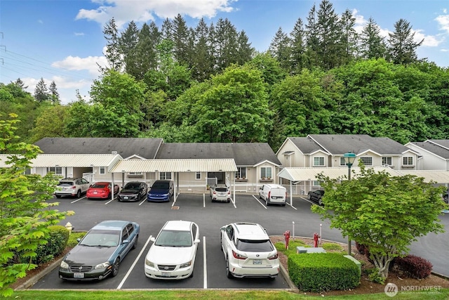 825 Harrington Pl SE Unit 2145, Renton, WA 98058 - uncovered parking lot featuring a residential view