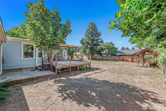 1332 Orchard Ave, Wenatchee, WA 98801 - fenced backyard featuring a deck and a patio