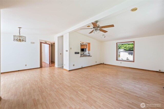 1332 Orchard Ave, Wenatchee, WA 98801 - unfurnished living room with a chandelier, light wood-style floors, a ceiling fan, and baseboards