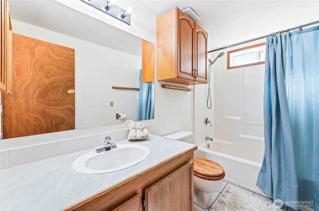 1332 Orchard Ave, Wenatchee, WA 98801 - bathroom featuring toilet, vanity, shower / bath combo with shower curtain, and tile patterned floors