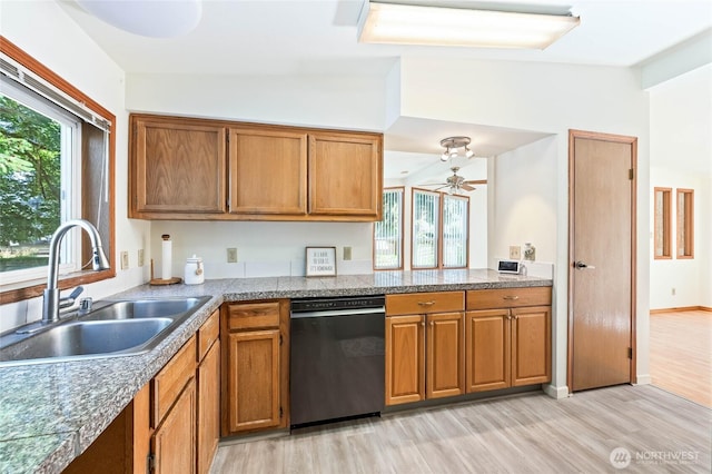 1332 Orchard Ave, Wenatchee, WA 98801 - kitchen featuring dishwasher, a sink, light wood-type flooring, and brown cabinets