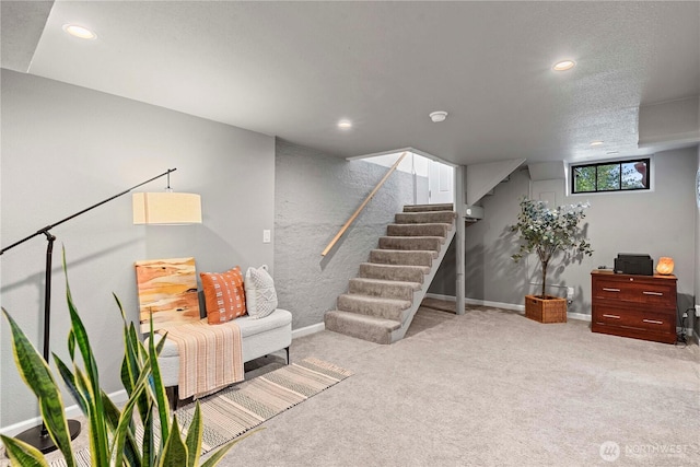 sitting room with stairway, baseboards, carpet flooring, and recessed lighting
