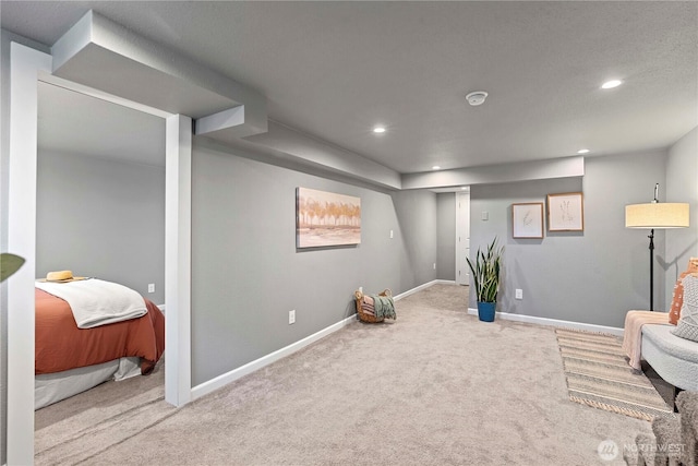 sitting room with baseboards, carpet flooring, and recessed lighting