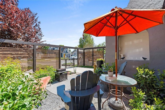 view of patio featuring fence