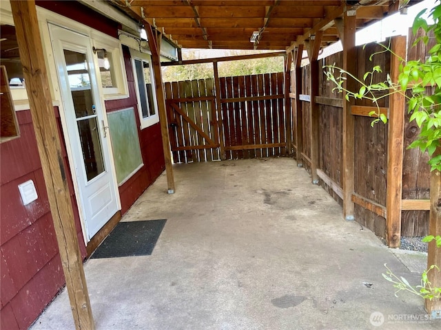 view of patio / terrace featuring fence