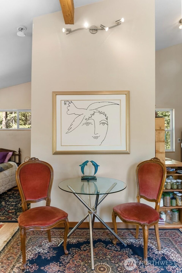 sitting room with wood finished floors and lofted ceiling