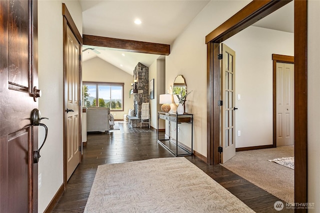 hallway featuring baseboards, lofted ceiling with beams, dark wood-style flooring, and recessed lighting