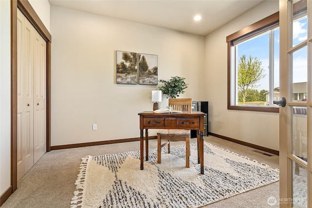 carpeted office space with recessed lighting, baseboards, and visible vents