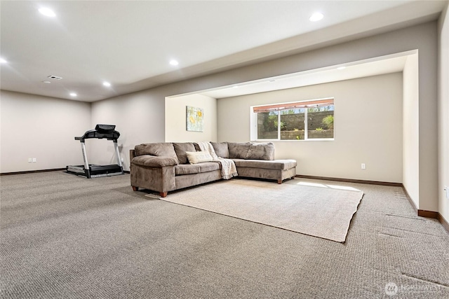 living room featuring carpet floors, baseboards, and recessed lighting