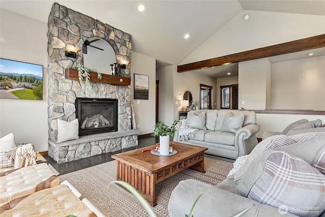 living room with high vaulted ceiling, a fireplace, and recessed lighting