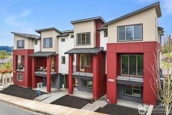 26520 NE 143rd Cir N Unit 28-C, Duvall, WA 98019 - townhome / multi-family property featuring stucco siding and a standing seam roof