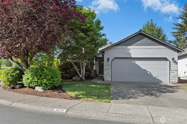 18711 22nd Dr SE, Bothell, WA 98012 - view of front of property featuring a garage, concrete driveway, and stone siding