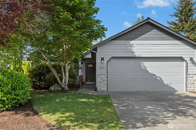 18711 22nd Dr SE, Bothell, WA 98012 - view of front of home with stone siding, a garage, driveway, and a front yard
