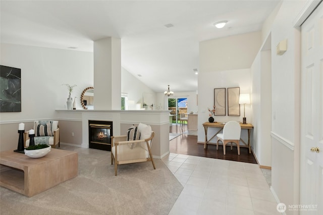 18711 22nd Dr SE, Bothell, WA 98012 - tiled living room with a chandelier, a glass covered fireplace, and lofted ceiling