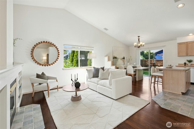 18711 22nd Dr SE, Bothell, WA 98012 - living room featuring vaulted ceiling, a chandelier, a fireplace, dark wood finished floors, and recessed lighting