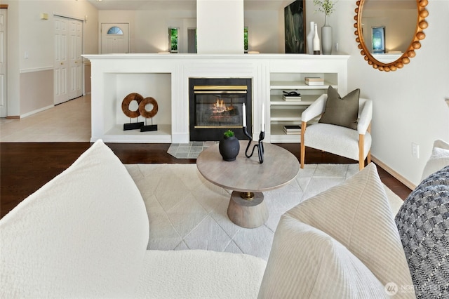 18711 22nd Dr SE, Bothell, WA 98012 - living room featuring baseboards, a glass covered fireplace, and wood finished floors