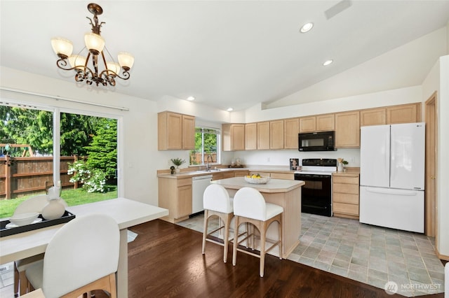 18711 22nd Dr SE, Bothell, WA 98012 - kitchen with white appliances, light brown cabinetry, light countertops, lofted ceiling, and a kitchen island
