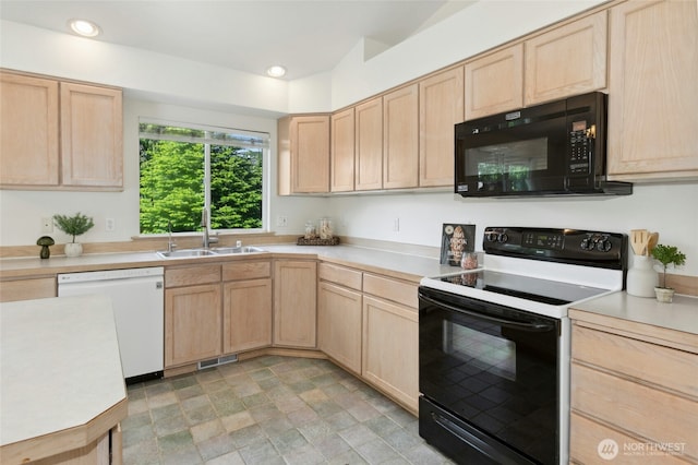 18711 22nd Dr SE, Bothell, WA 98012 - kitchen with black microwave, range with electric stovetop, light brown cabinets, dishwasher, and a sink