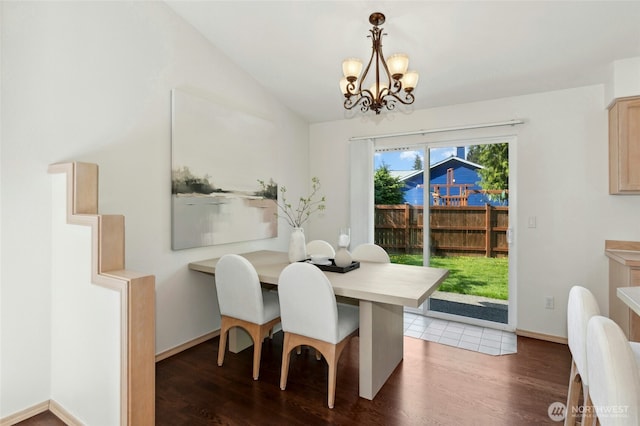 18711 22nd Dr SE, Bothell, WA 98012 - dining space featuring a chandelier, wood finished floors, vaulted ceiling, and baseboards