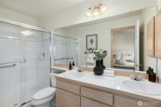 18711 22nd Dr SE, Bothell, WA 98012 - ensuite bathroom featuring double vanity, a shower stall, and toilet