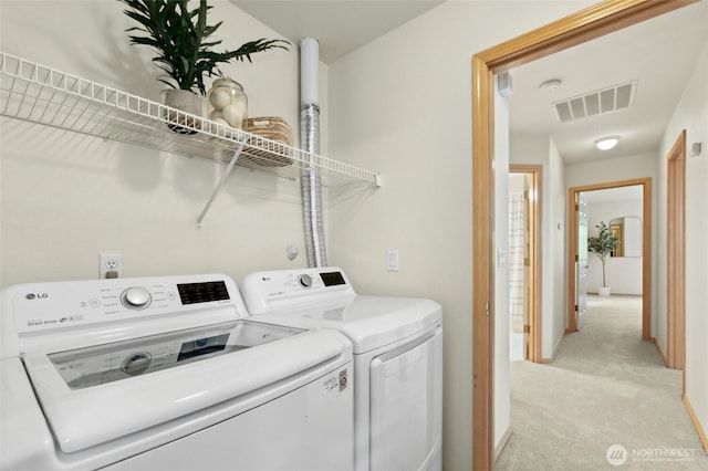 18711 22nd Dr SE, Bothell, WA 98012 - laundry room featuring washer and dryer, light carpet, and baseboards