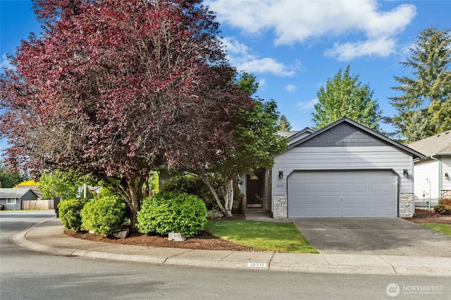 18711 22nd Dr SE, Bothell, WA 98012 - view of front of house featuring an attached garage, concrete driveway, and stone siding