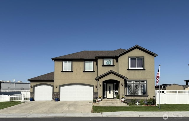 1755 E Madera St, Othello, WA 99344 - traditional home with fence, stucco siding, concrete driveway, and a front lawn