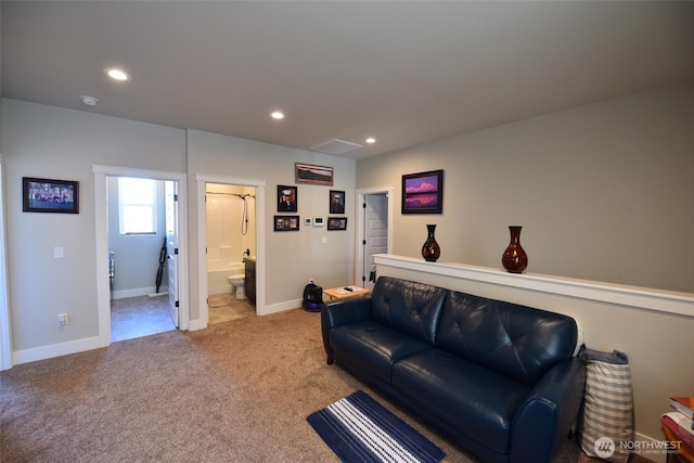 1755 E Madera St, Othello, WA 99344 - living area featuring recessed lighting, baseboards, visible vents, and light carpet