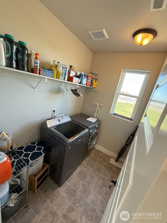 1755 E Madera St, Othello, WA 99344 - clothes washing area featuring laundry area, visible vents, and washer and clothes dryer