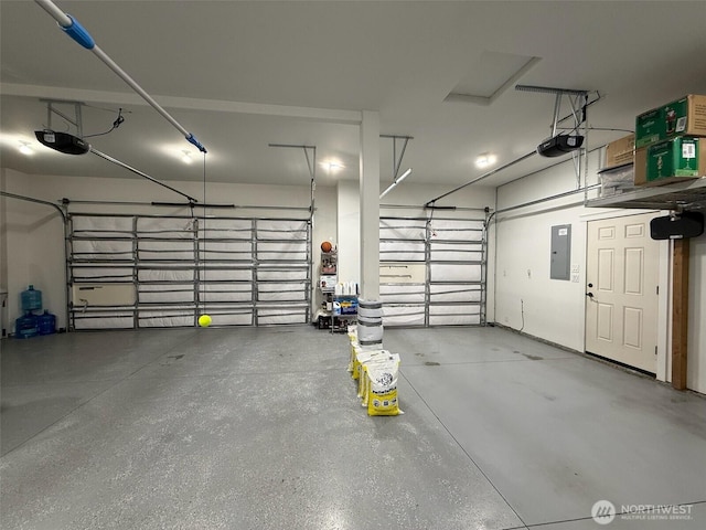 1755 E Madera St, Othello, WA 99344 - garage featuring a garage door opener and electric panel