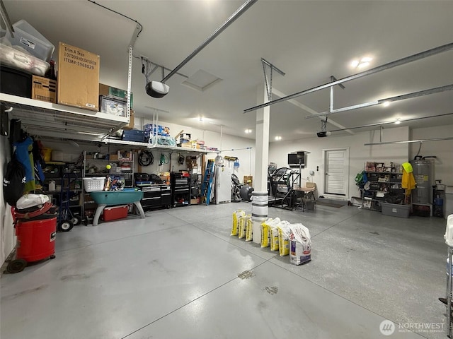 1755 E Madera St, Othello, WA 99344 - garage featuring water heater, a workshop area, and a garage door opener