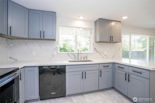 kitchen with dishwasher, a sink, healthy amount of natural light, a peninsula, and recessed lighting