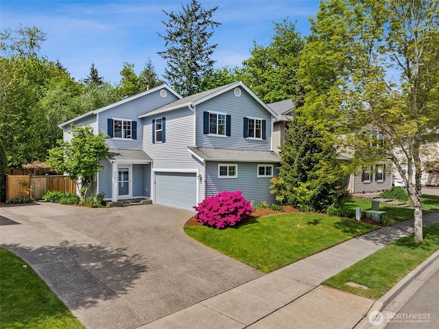 view of front of house featuring concrete driveway and a garage