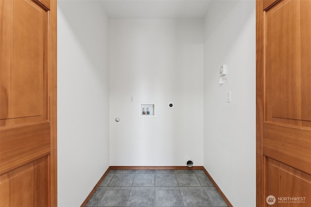 laundry area with hookup for an electric dryer, washer hookup, and baseboards