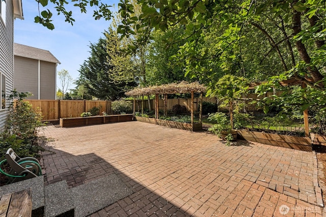 view of patio featuring a gazebo and a fenced backyard