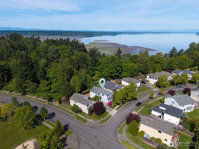 aerial perspective of suburban area featuring a nearby body of water