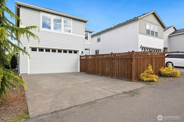 18709 138th Street Ct E, Bonney Lake, WA 98391 - view of front facade featuring an attached garage, fence, and concrete driveway