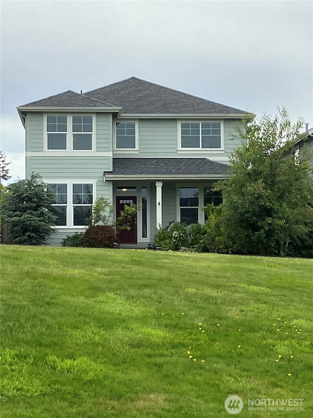 18709 138th Street Ct E, Bonney Lake, WA 98391 - view of front of property with a front yard and roof with shingles