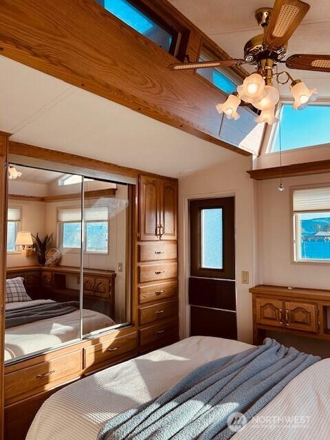 bedroom featuring vaulted ceiling with beams