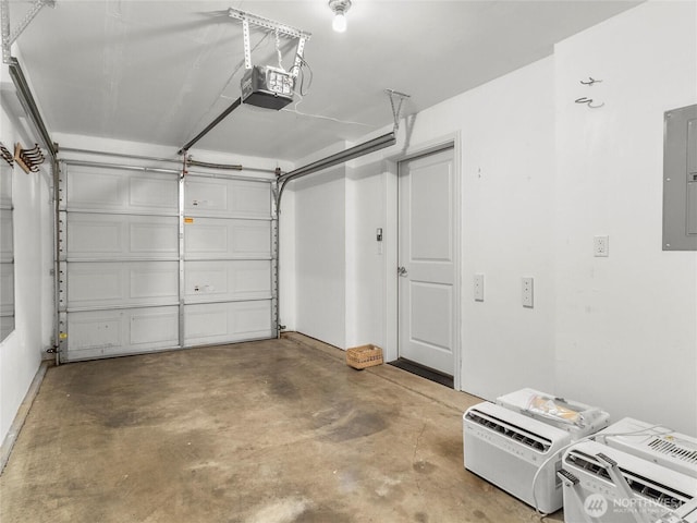 garage with a garage door opener and electric panel