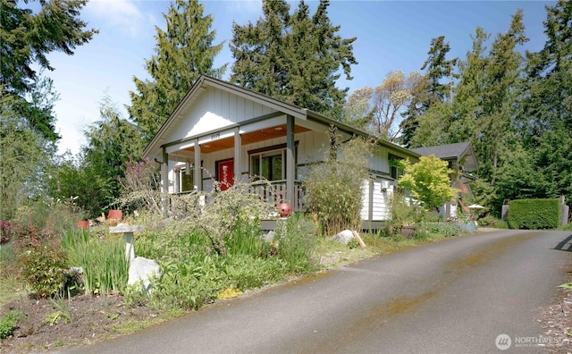2078 11th St, Port Townsend, WA 98368 - view of front facade featuring covered porch and board and batten siding