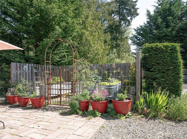 2078 11th St, Port Townsend, WA 98368 - view of patio / terrace featuring fence and a vegetable garden