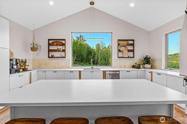 5601 Lewis River Rd, Ariel, WA 98603 - kitchen with a sink, stainless steel dishwasher, modern cabinets, light countertops, and lofted ceiling