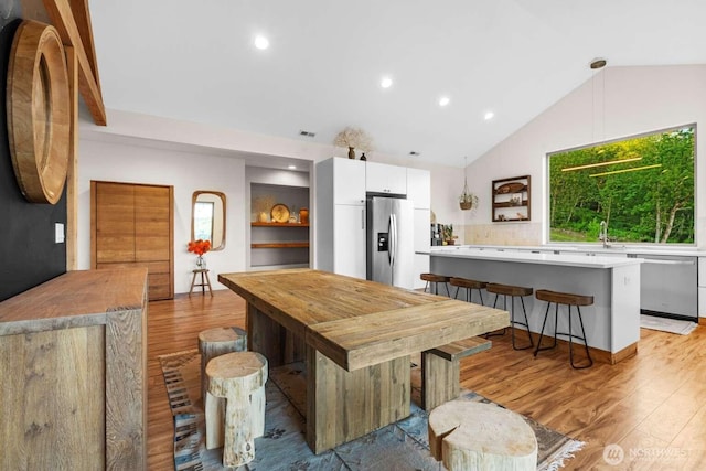 5601 Lewis River Rd, Ariel, WA 98603 - dining space with light wood-type flooring, lofted ceiling, and recessed lighting