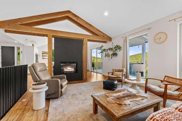 5601 Lewis River Rd, Ariel, WA 98603 - living area with vaulted ceiling, light wood-type flooring, a fireplace, plenty of natural light, and recessed lighting
