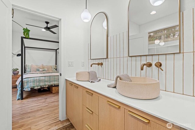 5601 Lewis River Rd, Ariel, WA 98603 - bathroom with ensuite bathroom, vanity, wood finished floors, and ceiling fan