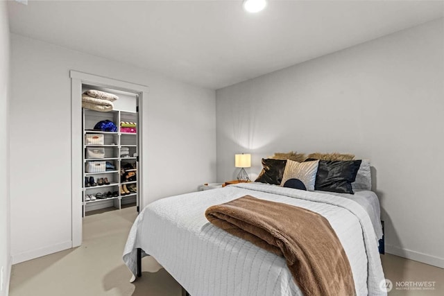 5601 Lewis River Rd, Ariel, WA 98603 - bedroom with finished concrete flooring and baseboards