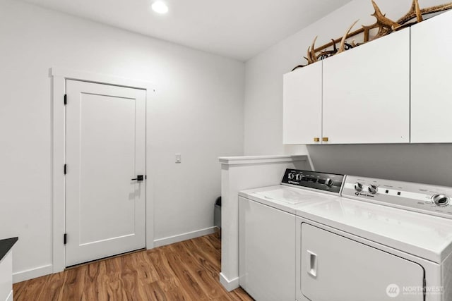 5601 Lewis River Rd, Ariel, WA 98603 - laundry room with cabinet space, independent washer and dryer, light wood-type flooring, baseboards, and recessed lighting